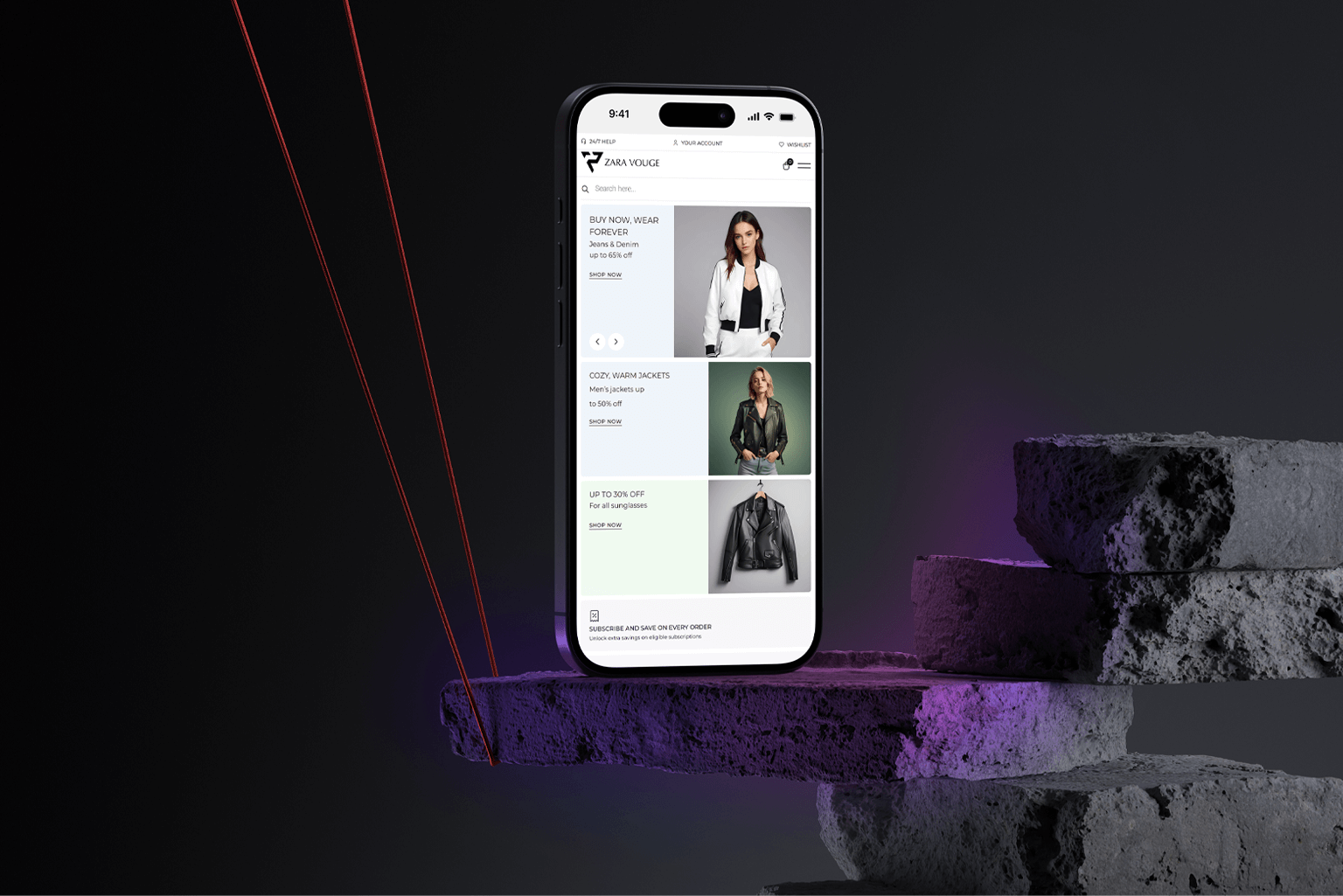 Mobile phone displaying Zara Vouge online store with stylish women's jackets on screen.